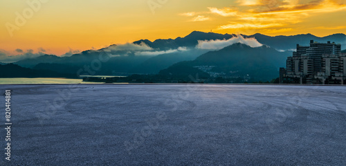 Asphalt road square and beautiful mountain natural landscape at dusk. panoramic view.