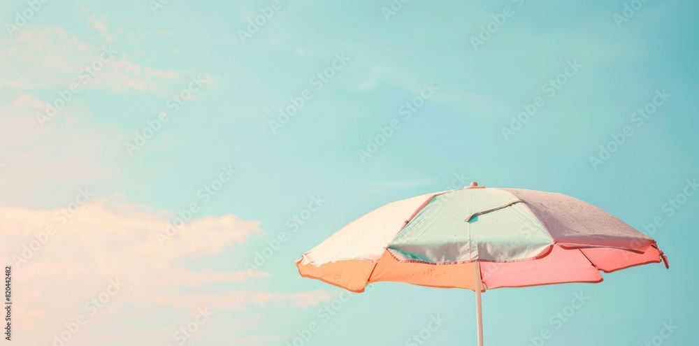 Shade and Serenity: Beach Umbrella on a Pastel Colored Background