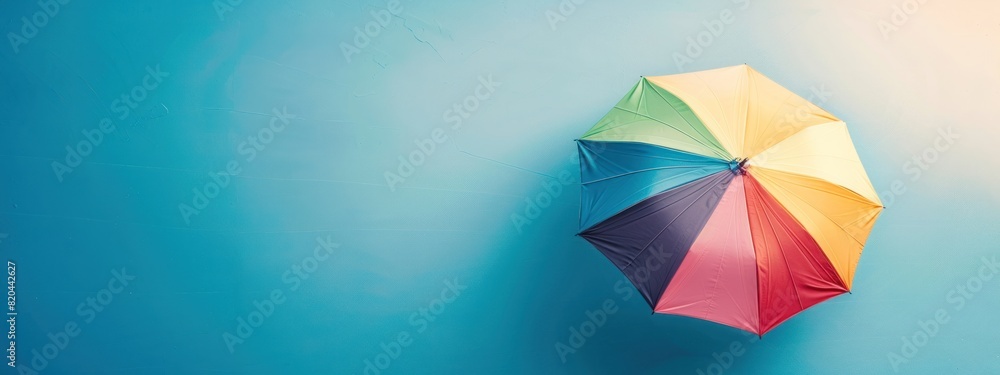 Vacation Mode: Flat-Laid Beach Umbrella and Summer Accessories on Blue Vacation Mode: Flat-Laid Beach Umbrella and Summer Accessories on Blue