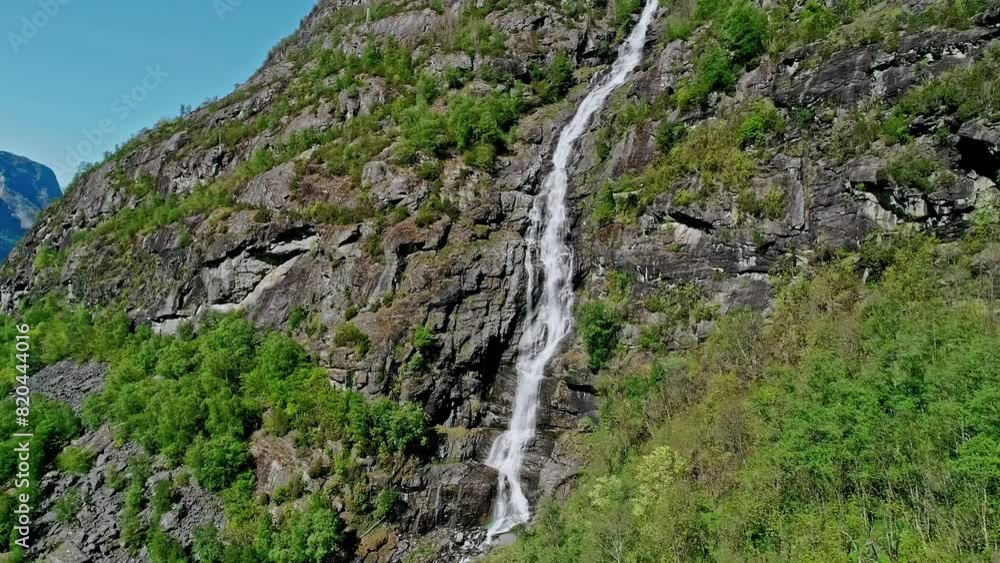Aerial view away from a waterfall in Central Norway, sunny, summer day Aerial view away from a waterfall in Central Norway, sunny, summer day
