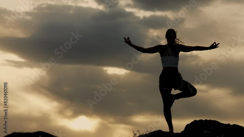 Wallpaper Mural Woman practicing yoga balance pose at sunset in the mountains. Torontodigital.ca