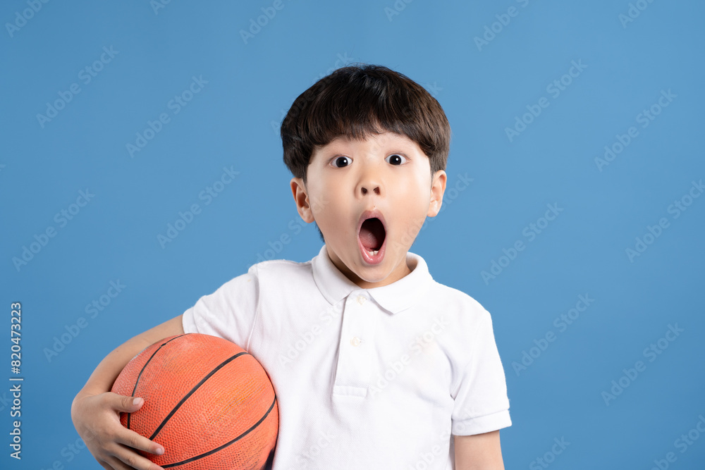Portrait of boy in tank top playing basketball and Portrait of boy in tank top playing basketball and