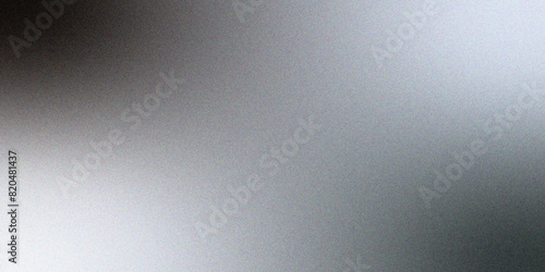 Abstract reflective shiny gray & white  foil gradient blurred shine. Glowing Gray foil glitter metallic wall texture. Gray color gradient, ombre effect with rough, grain, noise, and bright spots