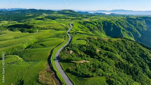 Drone aerial shots of spectacular greenery landscapes and blue sky. Dynamic natural scenery.