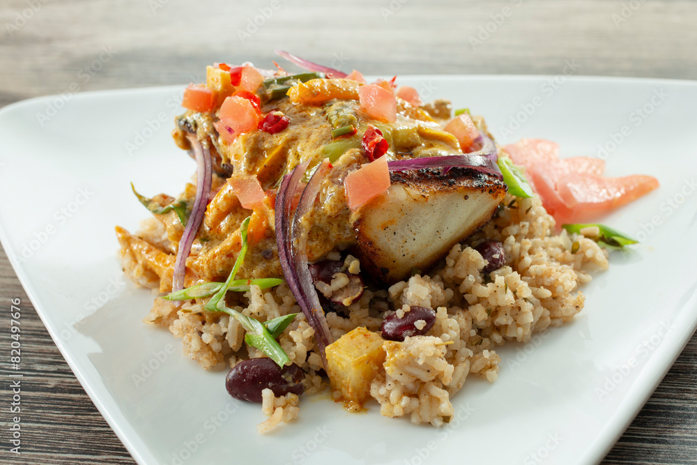 A view of a plate of curry fish. A view of a plate of curry fish.