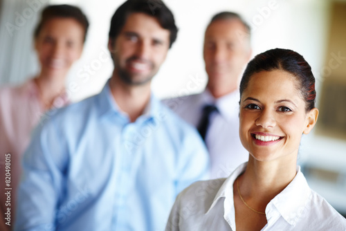 Leadership  portrait and smile of business woman in office with group for collaboration or management. Face  happy and teamwork with confident manager leading professional staff in workplace