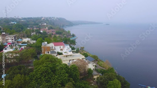 Aerial drone shot of resedential buildings around upper lake of bhopal capital city of madhya pradesh during morning time in India photo