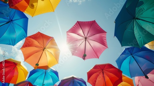 Group of rainbow umbrellas, symbolizing LGBTQ pride, perfect for promoting diversity, inclusion, and equality in weather and outdoor-themed projects.