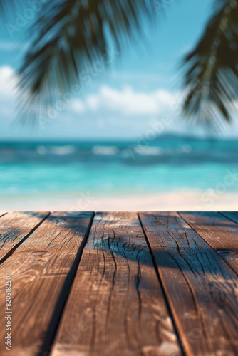 A wooden desk top with blurred background of beach. Good for background 