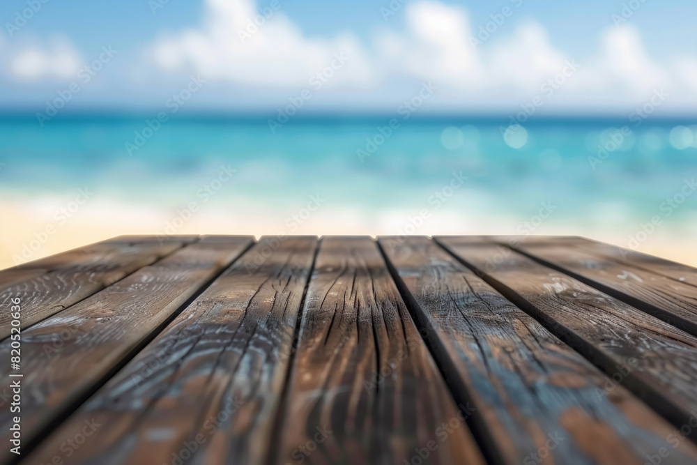 A wooden desk top with blurred background of beach. Good for background A wooden desk top with blurred background of beach. Good for background