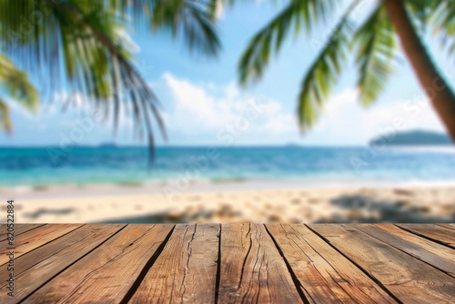 A wooden desk top with blurred background of beach. Good for background 