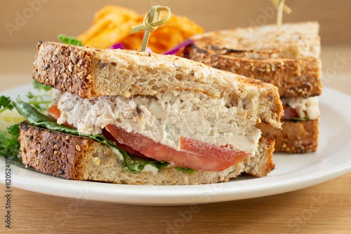 A closeup view of a tuna salad sandwich.