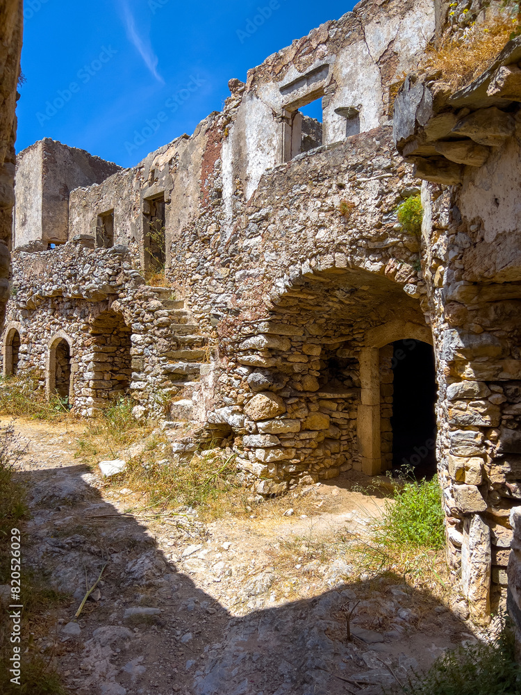 Fototapeta premium Kithira Kastro of Milopotamos Kato Chora Ionian islands, Greece. Old stonewall Venetian castle, abandoned building, monument at Kythera. 