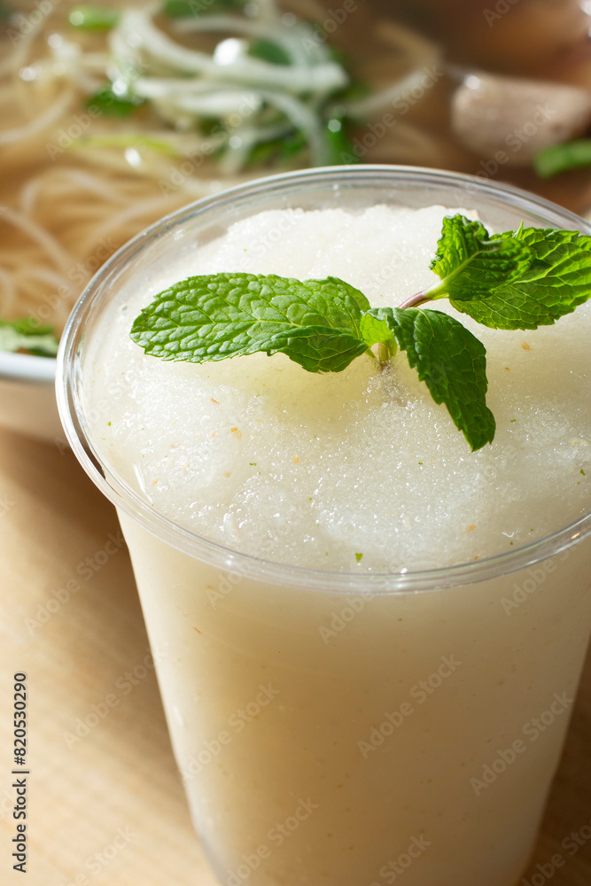 A closeup view of a lychee slushie drink.