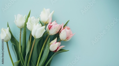 Mothers Day concept Top view photo of bouquet of white and pink tulips on isolated pastel blue background with copyspace   Generative AI