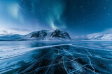 A frozen lake witn cracks, there is a snowcap mountain in the background. Aurora glowing in the sky