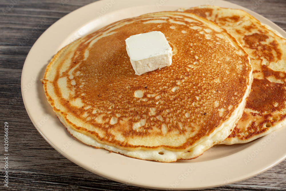 A view of a plate of pancakes. A view of a plate of pancakes.