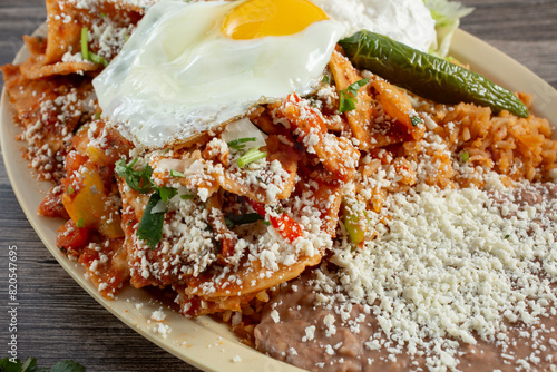 A closeup view of a plate of chilaquiles.