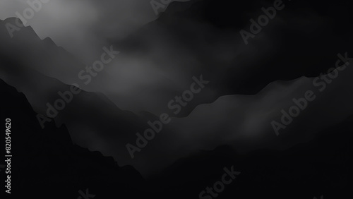 silhouetted evening dark mountains against a background of large clouds. Low angle view of mountains against cloudy sky during foggy weather. black and ash color evening sunset abstract background