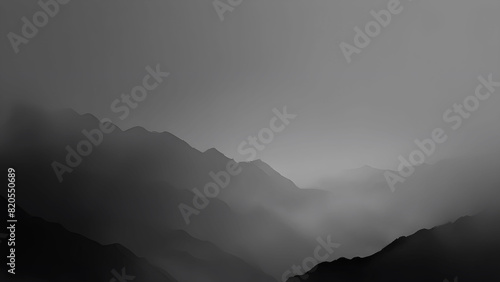 silhouetted evening dark mountains against a background of large clouds. Low angle view of mountains against cloudy sky during foggy weather. black and ash color evening sunset abstract background