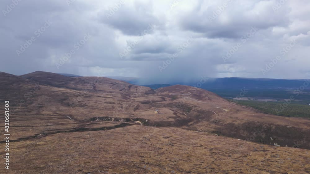 Cairngorms landscape, raining cloud in background, Scotland. Aerial forward Cairngorms landscape, raining cloud in background, Scotland. Aerial forward
