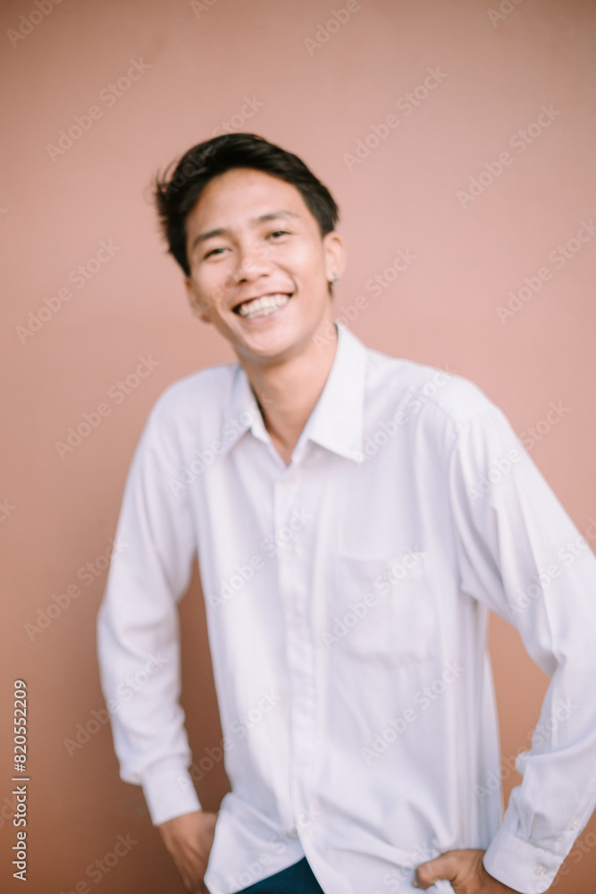 A man with a wide smile, looking forward, radiating joy and friendliness. A man with a wide smile, looking forward, radiating joy and friendliness.