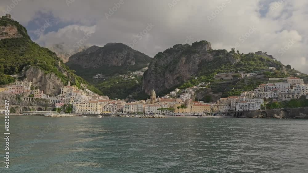Approaching the town of Amalfi by ferry, Amalfi is a beautiful town of the Amalfi coast, closer view. Approaching the town of Amalfi by ferry, Amalfi is a beautiful town of the Amalfi coast, closer view.