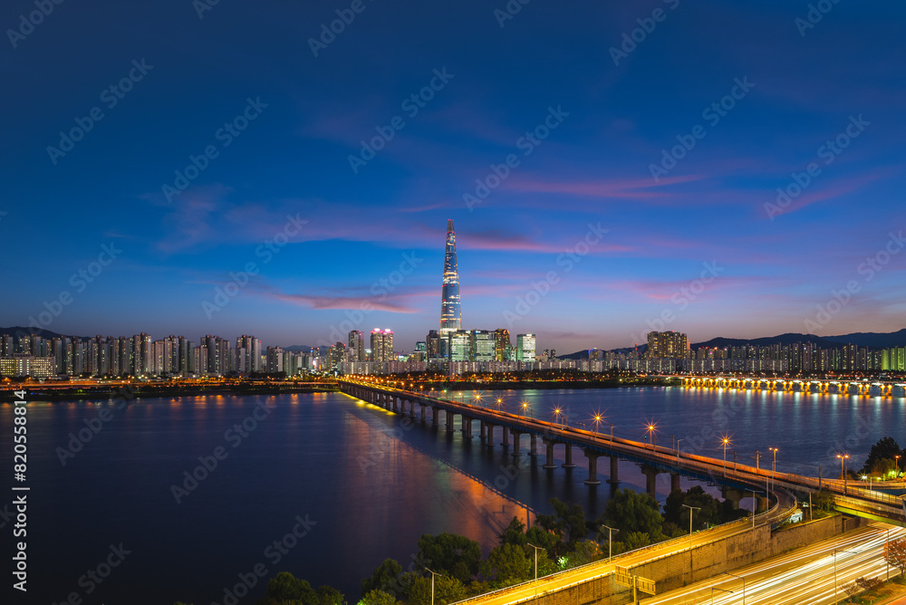 skyline of seoul by Han River in south korea at night
