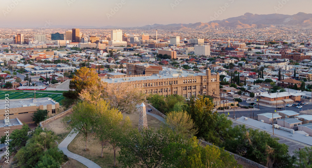 Fototapeta premium Local park and view of downtown El Paso at sunset, Texas, United States of America.