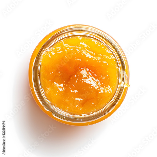 Apricot jam in a jar top view, isolated on white background