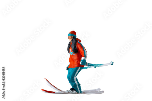 Miniature people   A skier full length Isolated with clipping path