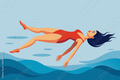 Woman lay down upturned on the surface of the sea.