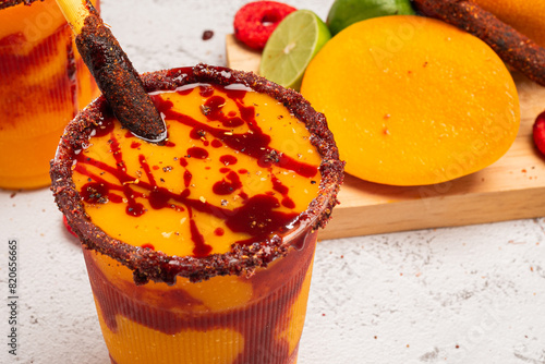 Mangonada, typical mexican mango smoothie with chamoy sauce and lime juice. photo