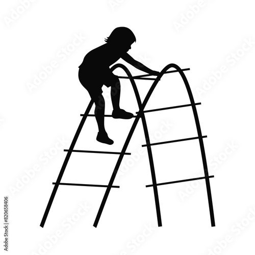 Kids play climb together, children's Playground. Children play on the Playground, child carefully crosses an arched ladder photo