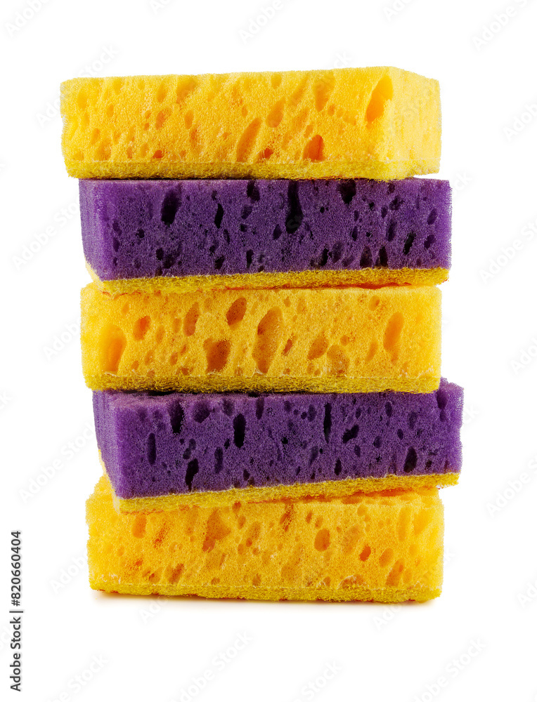 A tower of yellow and purple sponge isolated on a white background. Dishwashing sponge A tower of yellow and purple sponge isolated on a white background. Dishwashing sponge