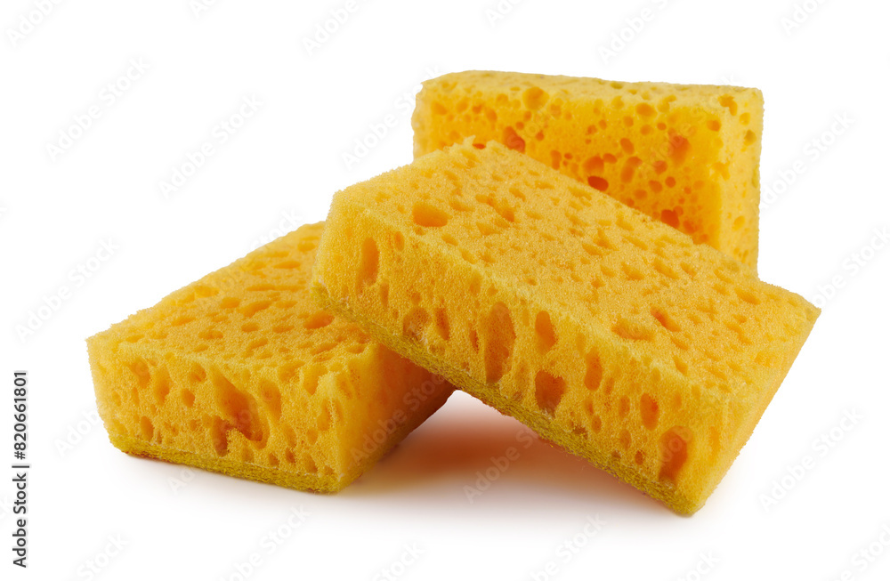 Several yellow sponges for washing dishes isolated on a white background. Household cleaning sponge. Several yellow sponges for washing dishes isolated on a white background. Household cleaning sponge.