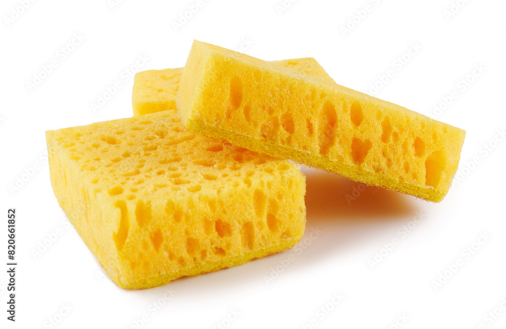 Several yellow sponges for washing dishes isolated on a white background. Household cleaning sponge. Several yellow sponges for washing dishes isolated on a white background. Household cleaning sponge.