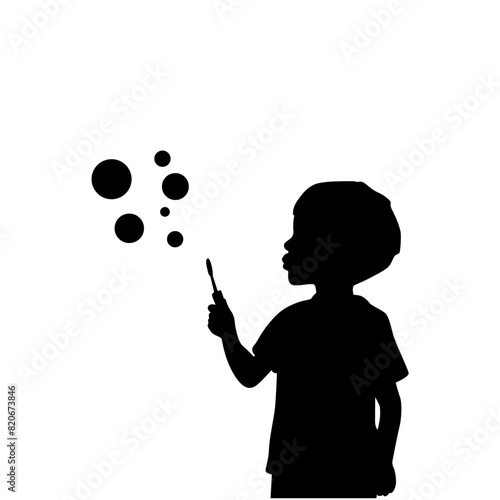 Little boy blowing to make many bubbles, boy plays with soap bubbles silhouette