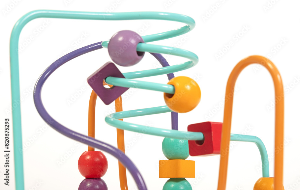 Children's developing toy, a labyrinth of wooden beads isolated on white baskground Children's developing toy, a labyrinth of wooden beads isolated on white baskground