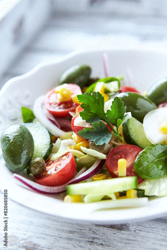Simple Salad with Green Olives, Cucumber and Cherry Tomatoes. Bright wooden background. Simple Salad with Green Olives, Cucumber and Cherry Tomatoes. Bright wooden background.