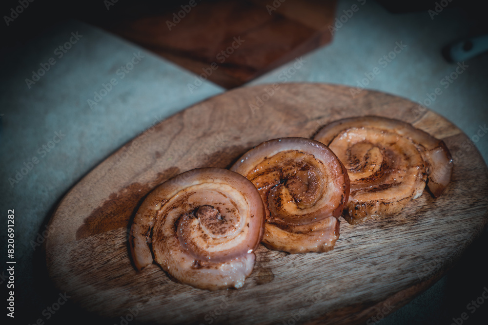 Men tie ropes and cut pork to make Japanese-style pork slices. Men tie ropes and cut pork to make Japanese-style pork slices.