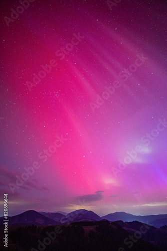 Massive solar storm with pink aurora borealis over central europe. Northern light event on May 10, 2024 over Austria, Europe.