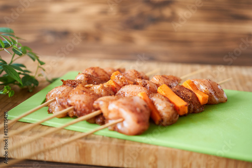 Chicken kebab. Close-up of skewers with marinated chicken meat in spicy sauce.