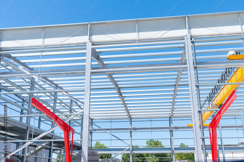 metallic structure of an industrial building under construction metallic structure of an industrial building under construction