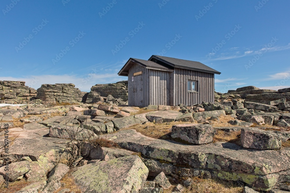 Outside view of Nattanen fireman´s cabin on top of Pyhä-Nattanen fell in spring with clouds in the sky, Sompio Strict Nature Reserve, Lapland, Finland.
