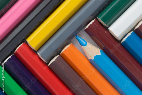 Multi-colored pencils folded at an angle