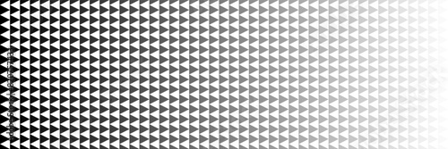 horizontal halftone of blended black triangle to gray design for pattern and background.