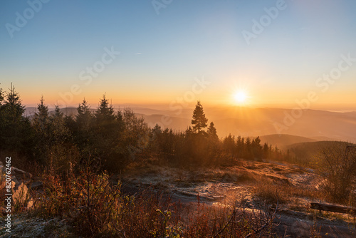 Sunrise from Lysa hora hill in Moravskoslezske Beskydy mountains in Czech republic photo
