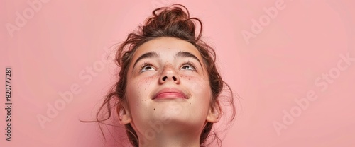 Against A Soft Pink Backdrop, An Optimistic And Cheerful Girl Gazes Upwards, Her Expression Radiant With Positivity And Hope, Filling The Space With A Sense Of Optimism And Brightness
