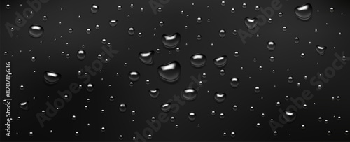 Water drops, realistic droplets of liquid on a black background.